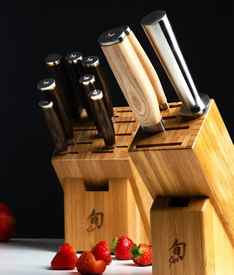Two knife block sets with knives in block and strawberries